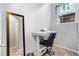 Bright home office features a standing desk, chair, and ample natural light at 1300 Garfield St # 9, Denver, CO 80206