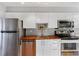 Updated kitchen featuring stainless steel appliances and wood countertops at 1300 Garfield St # 9, Denver, CO 80206