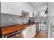 Modern kitchen with stainless steel appliances and butcher block countertops at 1300 Garfield St # 9, Denver, CO 80206