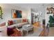 Bright living room features stylish furniture, large artwork, and an open floor plan at 1300 Garfield St # 9, Denver, CO 80206