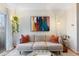 Cozy living room featuring a comfortable sofa, artwork, and natural light at 1300 Garfield St # 9, Denver, CO 80206