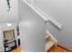 Modern staircase with neutral walls and carpeted steps at 1300 Garfield St # 9, Denver, CO 80206