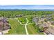 Wide aerial view showcasing a community with pathways, green spaces, and distant views of the mountain range at 1130 Summit View Dr, Louisville, CO 80027