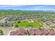A panoramic aerial showcases the community park with walkways, mountain views, and a mix of residential homes at 1130 Summit View Dr, Louisville, CO 80027