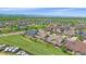 This elevated aerial shows the residential area, a community park, and clear mountain views in the background at 1130 Summit View Dr, Louisville, CO 80027