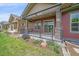 Inviting back patio featuring an iron railing and landscaped garden, perfect for outdoor enjoyment and relaxation at 1130 Summit View Dr, Louisville, CO 80027