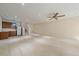 Finished basement with kitchenette, carpet floors, and stairs to the upper level at 1130 Summit View Dr, Louisville, CO 80027