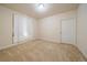 Bedroom features carpet flooring, trim, neutral walls, and a window at 1130 Summit View Dr, Louisville, CO 80027