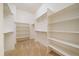Walk-in closet featuring custom shelving for storage at 1130 Summit View Dr, Louisville, CO 80027