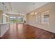 Bright living room with hardwood floors, fireplace, ceiling fan and lots of natural light at 1130 Summit View Dr, Louisville, CO 80027