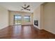 Cozy living room with hardwood floors, a fireplace, and access to the outdoor patio at 1130 Summit View Dr, Louisville, CO 80027