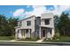 Modern two-story townhomes featuring stone accents and colorful front doors with well-maintained landscaping at 17095 E Alameda Pkwy, Aurora, CO 80017