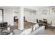 Basement space featuring gray LVP flooring and a dining area at 3328 S Danube St, Aurora, CO 80013