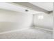 Unfinished basement space with gray carpet and a small window at 3328 S Danube St, Aurora, CO 80013
