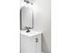 Stylish bathroom vanity with arched mirror and black hardware at 3328 S Danube St, Aurora, CO 80013