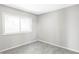Bright bedroom featuring a large window and neutral gray carpet at 3328 S Danube St, Aurora, CO 80013