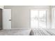 Bright bedroom featuring a sliding glass door to balcony and neutral decor at 3328 S Danube St, Aurora, CO 80013