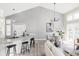 Open concept dining area with modern lighting, stylish decor, and seamless flow to living spaces at 3328 S Danube St, Aurora, CO 80013