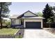Charming home featuring a well-maintained front yard and attached two-car garage in a lovely community at 3328 S Danube St, Aurora, CO 80013