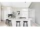 Modern kitchen features granite countertops, stainless steel appliances, and a breakfast bar at 3328 S Danube St, Aurora, CO 80013