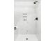 Modern shower features marble tile, built-in niche, and sleek black fixtures at 3328 S Danube St, Aurora, CO 80013