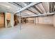 Unfinished basement with concrete floor and exposed beams, offering endless possibilities for customization and additional living space at 4748 Weitbrec Ln, Castle Rock, CO 80104