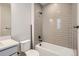 Bathroom featuring a white vanity and tub with shower with gray tiled wall at 4748 Weitbrec Ln, Castle Rock, CO 80104