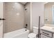 Gray subway tile surrounds the tub/shower in this bathroom with white vanity and sleek, modern black fixtures at 4748 Weitbrec Ln, Castle Rock, CO 80104