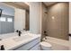 Stylish bathroom featuring a white vanity, modern fixtures, and attractive gray subway tile in the shower at 4748 Weitbrec Ln, Castle Rock, CO 80104
