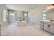 Large main bathroom features a soaking tub, glass shower, and double sink vanity at 4748 Weitbrec Ln, Castle Rock, CO 80104