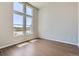Bedroom featuring big windows with mountain views, hardwood floors and neutral paint at 4748 Weitbrec Ln, Castle Rock, CO 80104