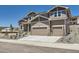 Charming two-story house boasting a two-car garage and attractive stone detailing at 4748 Weitbrec Ln, Castle Rock, CO 80104