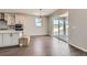 Bright kitchen with stainless steel appliances, hardwood floors, and sliding door access to the patio at 4748 Weitbrec Ln, Castle Rock, CO 80104