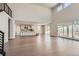 Open-concept living room flows into a modern kitchen, featuring high ceilings and natural light at 4748 Weitbrec Ln, Castle Rock, CO 80104