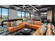 Inviting multi-purpose room with stylish seating, a shuffleboard table, and fireplace at 4748 Weitbrec Ln, Castle Rock, CO 80104