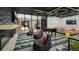 Cozy multi-purpose room featuring a fireplace, foosball table, and plush seating at 4748 Weitbrec Ln, Castle Rock, CO 80104
