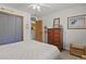 Bedroom with natural light, neutral walls, light-colored carpet, and wood accents around the doors and windows at 35550 Running Brook Ln, Elizabeth, CO 80107
