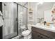 Modern bathroom features a tiled shower with a glass door, floating shelves, and a vessel sink at 1669 Stable View Dr, Castle Pines, CO 80108