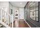 Welcoming entryway with hardwood floors, stylish decor, and a view of the staircase at 1669 Stable View Dr, Castle Pines, CO 80108