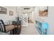 Basement hallway with a wine bar on a barrel, stairway, and a decorative console table at 1669 Stable View Dr, Castle Pines, CO 80108