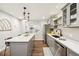 Bright kitchen with quartz countertops, stainless steel appliances, and hardwood floors at 1669 Stable View Dr, Castle Pines, CO 80108