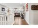 Upstairs living room featuring hardwood floors and a decorative industrial style at 1669 Stable View Dr, Castle Pines, CO 80108