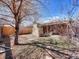 Backyard featuring a patio, fireplace, and a mix of lawn and landscaping at 732 Poplar St, Denver, CO 80220