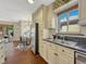 Bright kitchen with stainless steel appliances and view to dining and living area at 732 Poplar St, Denver, CO 80220