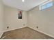 Simple room with neutral walls, carpeted flooring, and a small window, offering a versatile space at 732 Poplar St, Denver, CO 80220