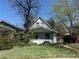 Charming two-story home with small front porch and quaint landscaping in established neighborhood at 3950 Lowell Blvd, Denver, CO 80211