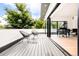 Modern deck with chairs and view of the surrounding area at 6435 E 6Th Avenue Pkwy, Denver, CO 80220