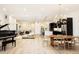 Open concept dining area with large wood table and modern chairs at 6435 E 6Th Avenue Pkwy, Denver, CO 80220