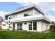 Contemporary home with white brick exterior, gray accents, and a well-maintained lawn at 6435 E 6Th Avenue Pkwy, Denver, CO 80220