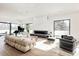 Modern living room with hardwood floors, fireplace, and large windows at 6435 E 6Th Avenue Pkwy, Denver, CO 80220